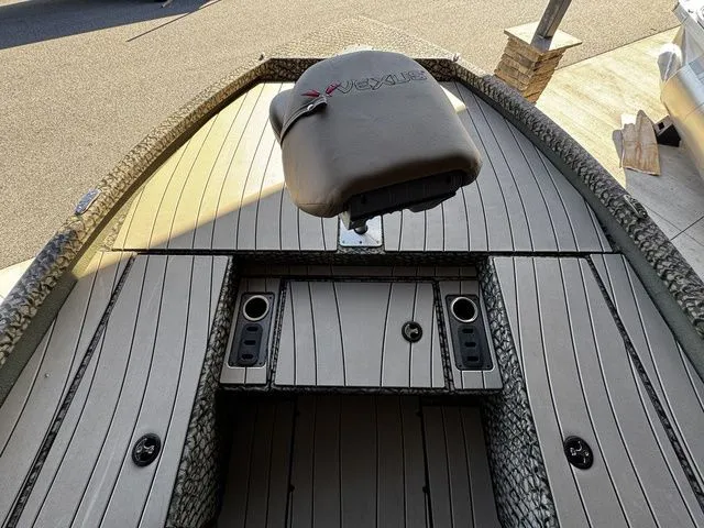 Slide: The Image of 2025 Vexus ACX2150 boat deck with seating and storage compartments. - 8