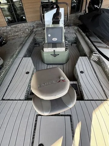 Slide: The Image of 2025 Vexus ACX2150 boat interior with sleek seating and modern design. - 9