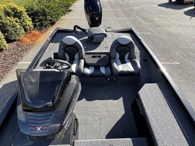 Slide: The Image of 2023 Vexus AVX181 boat interior with dual seats and steering console. - 12