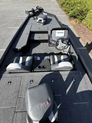 Slide: The Image of 2023 Vexus AVX181 boat interior with seats, steering wheel, and Lowrance system. - 4