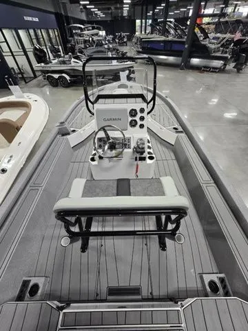 Slide: The Image of 2025 Vexus ACX2210 boat interior with Garmin controls, displayed in a showroom. - 4