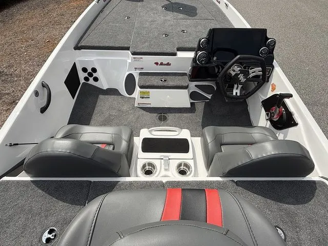 Slide: The Image of 2026 Bass Cat Pantera Classic boat interior with gray seats and modern dashboard. - 5