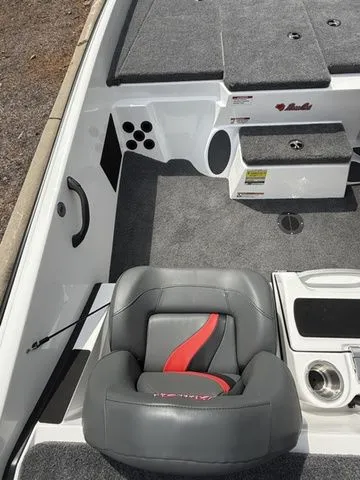 Slide: The Image of 2026 Bass Cat Pantera Classic boat interior with gray seating and storage compartments. - 7