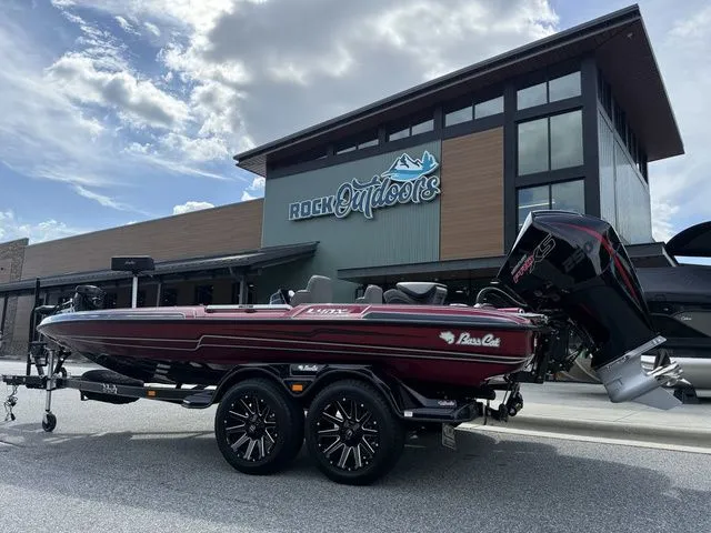 The Image of 2026 Bass Cat Lynx STS boat on trailer outside Rock Outdoors store. - 1