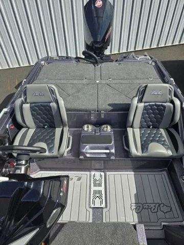 Slide: The Image of 2025 Bass Cat Lynx STS boat interior with modern steering and seating design. - 3