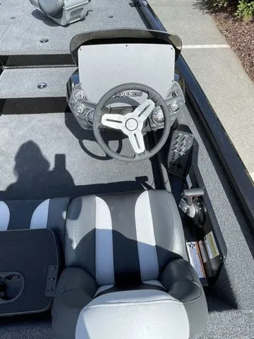 Slide: The Image of 2023 Vexus AVX181 boat interior with steering wheel and seating. - 6