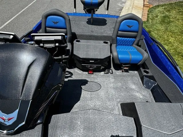Slide: The Image of 2024 Vexus VXS20 boat interior with blue seats and Garmin electronics. - 14