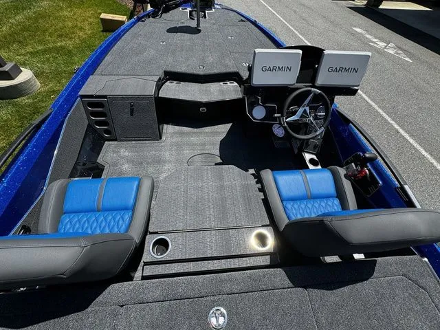 Slide: The Image of 2024 Vexus VXS20 boat interior with dual Garmin displays and blue seating. - 6