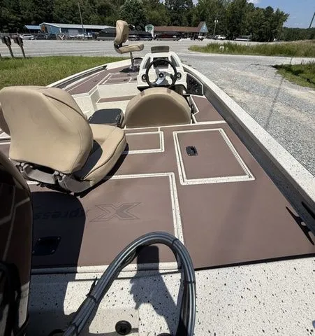 Slide: The Image of 2022 Xpress Boats H17C fishing boat with beige seats and spacious deck layout. - 3