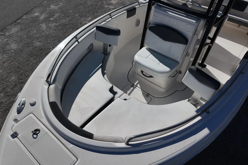 Slide: The Image of 2021 Robalo R222 Center Console boat interior with seating and storage. - 12