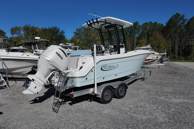 Slide: The Image of 2021 Robalo R222 Center Console boat with Yamaha engine on trailer. - 2
