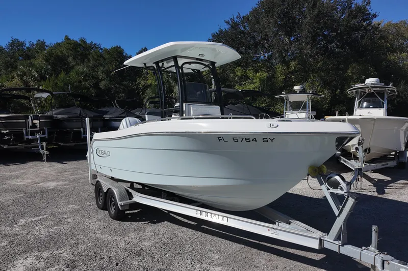 Slide: The Image of 2021 Robalo R222 Center Console boat on trailer, parked outdoors. - 4
