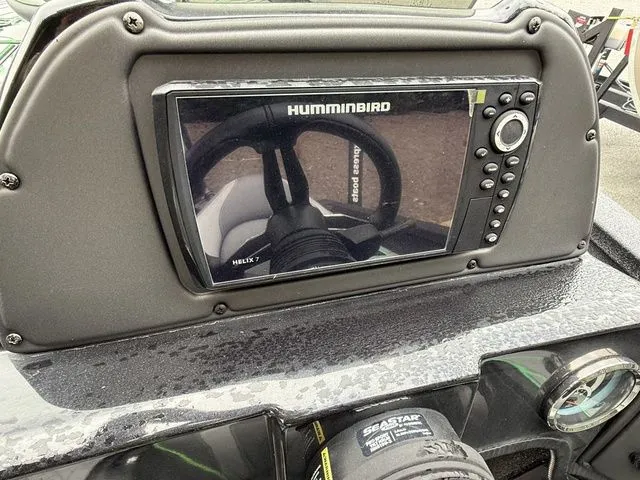 Slide: The Image of 2023 Xpress Boats X19 PRO dashboard with Humminbird Helix 7 fishfinder display. - 8
