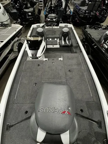 Slide: The Image of 2024 Vexus AVX1980C fishing boat interior with seating and storage compartments. - 11