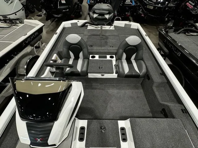 Slide: The Image of 2024 Vexus AVX1980C boat interior with dual seats and modern dashboard. - 12