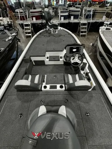 Slide: The Image of 2024 Vexus AVX1980C fishing boat interior with seating and steering console. - 3