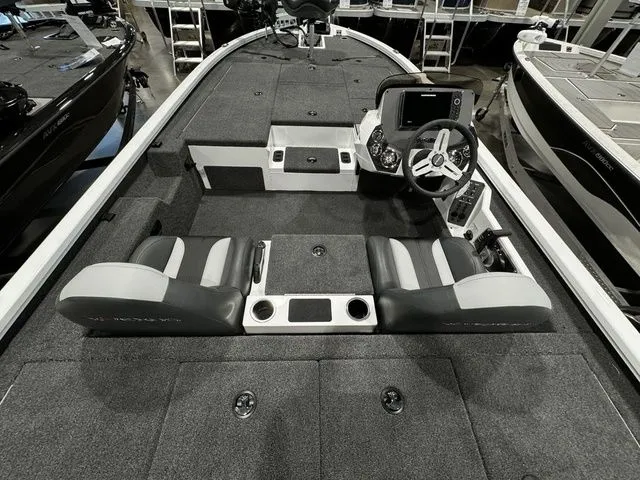 Slide: The Image of 2024 Vexus AVX1980C boat interior with dual seats and steering console. - 4
