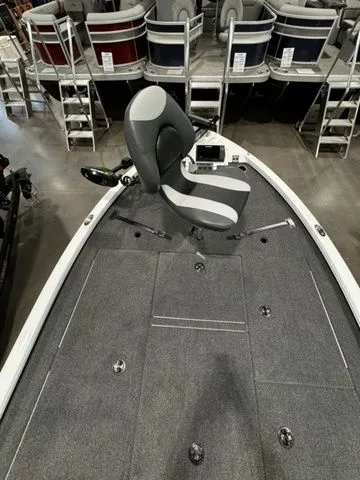 Slide: The Image of 2024 Vexus AVX1980C boat interior with gray seating and carpeted deck. - 8