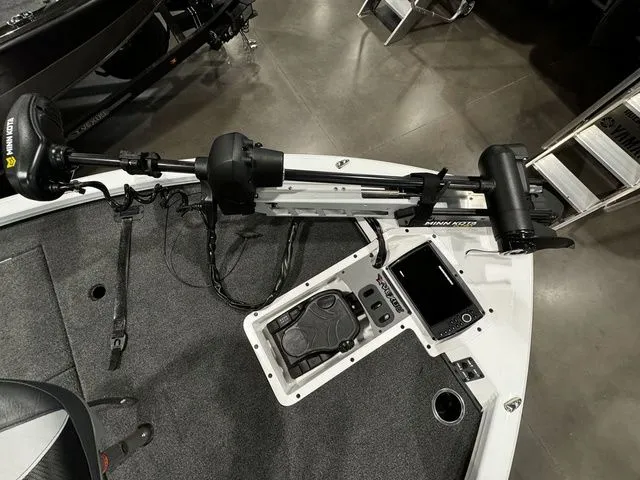 Slide: The Image of 2024 Vexus AVX1980C boat deck with Minn Kota trolling motor and control panel. - 9