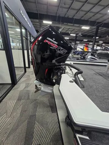 Slide: The Image of 2024 Vexus AVX2080 boat with Mercury Pro XS engine in showroom. - 2