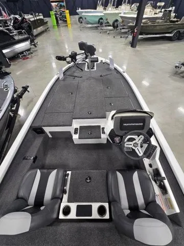 Slide: The Image of 2024 Vexus AVX2080 boat interior with dual seats, steering console, and fishing deck. - 4