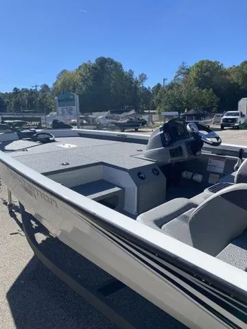 Slide: The Image of 2023 G3 Sportsman 1710 boat, gray interior, parked outdoors on a sunny day. - 7