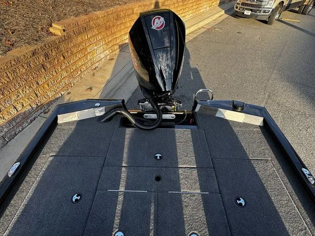 Slide: The Image of 2024 Vexus AVX2080 boat with powerful outboard motor, parked on a street. - 14