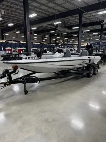 Slide: The Image of 2025 Ikon Boats VLX21 on trailer in showroom, sleek design, modern features. - 2