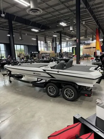 Slide: The Image of 2025 Ikon Boats VLX21 on trailer in showroom, sleek design, modern interior. - 3