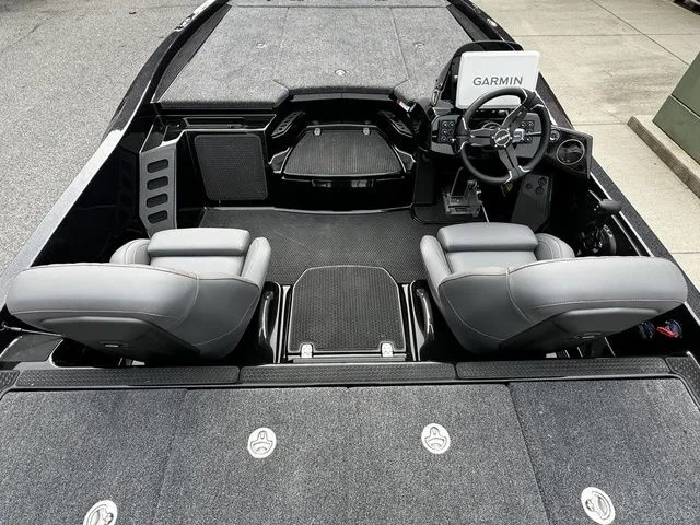 Slide: The Image of 2025 Ikon Boats VLX21 interior with Garmin navigation, featuring sleek gray seating and modern dashboard. - 4