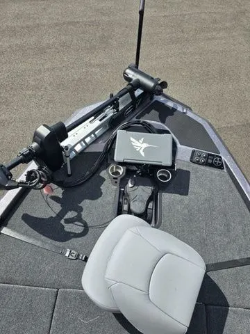 Slide: The Image of 2026 Ikon Boats LXE20 deck with advanced navigation system and comfortable seating. - 2