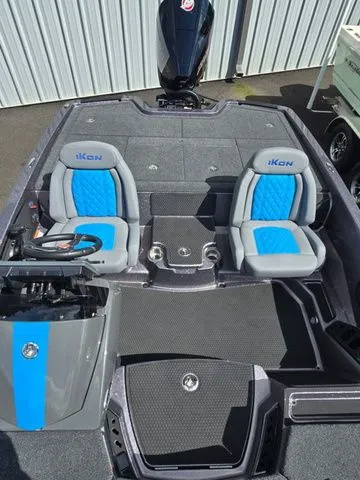 Slide: The Image of 2026 Ikon Boats LXE20 interior with blue and gray seating, modern design. - 6