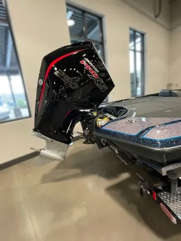 Slide: The Image of 2023 Bullet 21XRS boat with powerful engine, showcased indoors. - 3