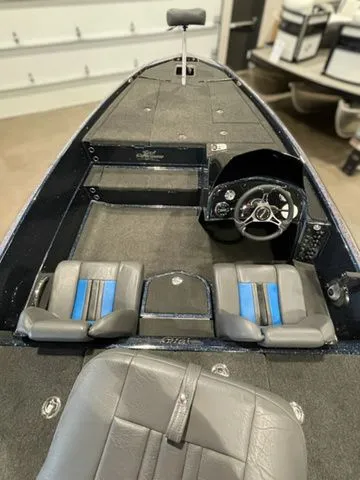 Slide: The Image of 2023 Bullet 21XRS boat interior with steering wheel and seating. - 4