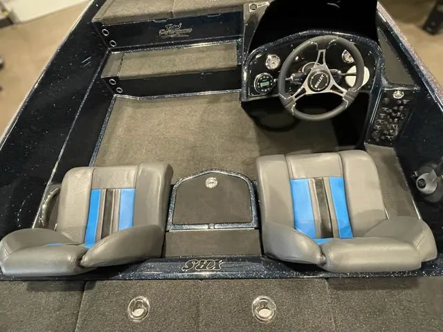 Slide: The Image of 2023 Bullet 21XRS boat interior with dual seats and steering console. - 5