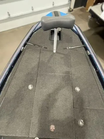 Slide: The Image of 2023 Bullet 21XRS boat interior with gray seating and carpeted deck. - 6