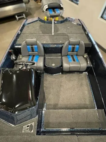 Slide: The Image of 2023 Bullet 21XRS boat interior with dual seats and steering console. - 8