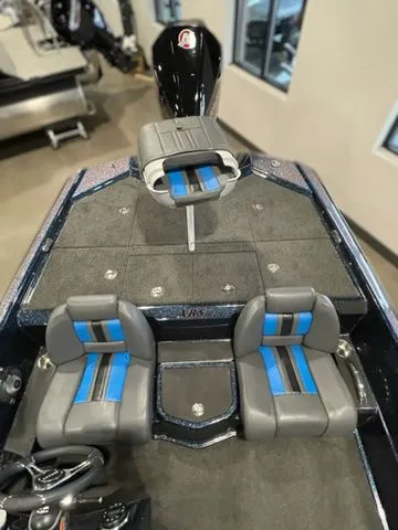 Slide: The Image of 2023 Bullet 21XRS boat interior with blue-accented seats and sleek design. - 9