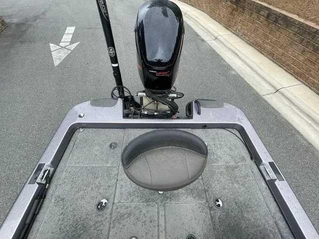 Slide: The Image of 2008 Bee Line Super Vee boat with motor on a paved road. - 16