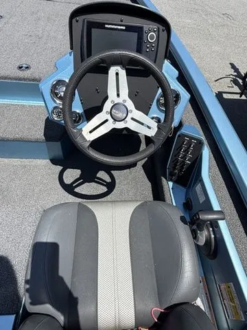 Slide: The Image of 2021 Vexus AVX1880 boat cockpit with steering wheel and control panel. - 5