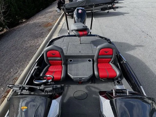 Slide: The Image of 2024 Vexus VXS20 boat with red and black seating, advanced controls, and sleek design. - 12
