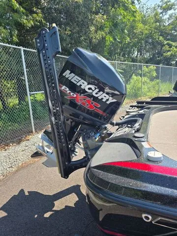 Slide: The Image of 2018 Nitro Z21 boat with Mercury Pro XS engine, parked outdoors. - 3