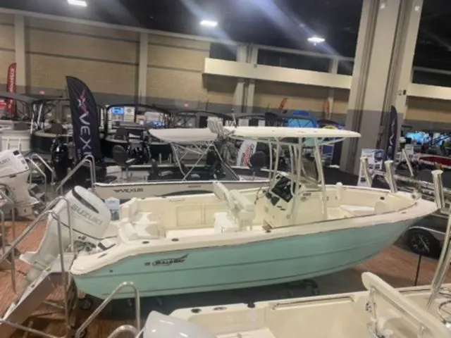 The Image of 2025 Bulls Bay 230CC boat displayed at an indoor boat show. - 1