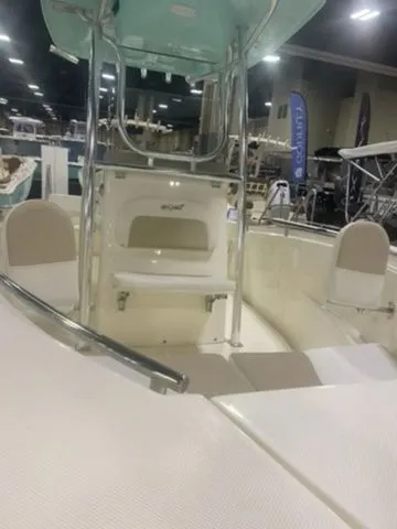 Slide: The Image of 2025 Bulls Bay 230CC boat interior at a showroom, featuring seating and modern design. - 7
