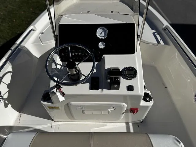 Slide: The Image of 2025 Bulls Bay 2000 boat console with steering wheel and gauges. - 5