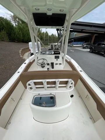 Slide: The Image of 2024 Pioneer Sportfish 202 boat interior with console and seating, ideal for fishing. - 4
