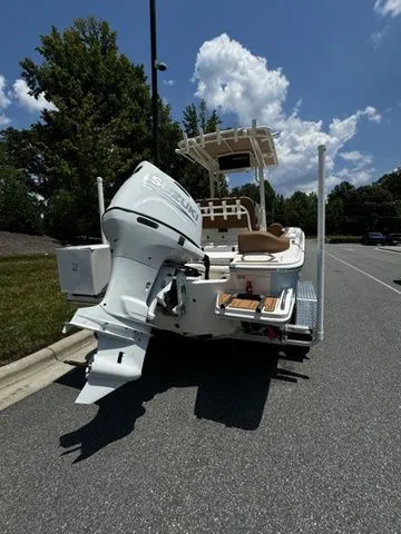 Slide: The Image of 2025 Pioneer ISLANDER 202 boat with outboard motor on a sunny day. - 3
