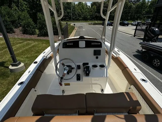 Slide: The Image of 2025 Pioneer ISLANDER 202 boat interior with steering console and seating. - 5