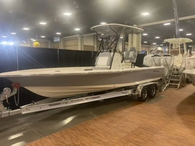 The Image of 2025 Avenger Boats AV24 on display indoors, mounted on a trailer. - 1
