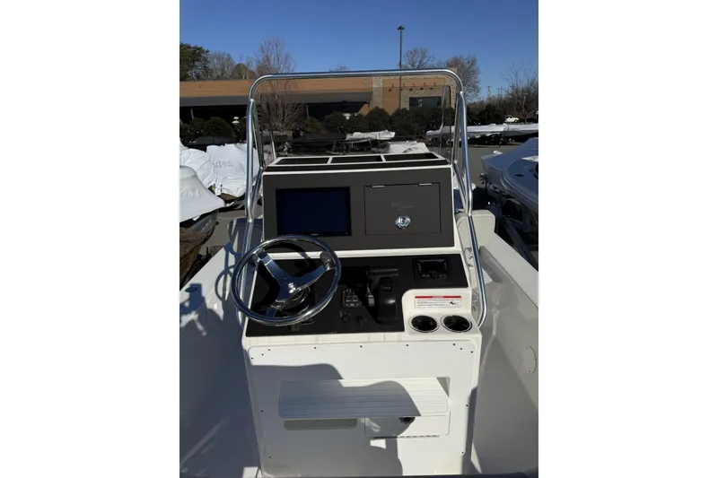 Slide: The Image of 2025 Bay Rider 219 Bay boat console with steering wheel and controls. - 3